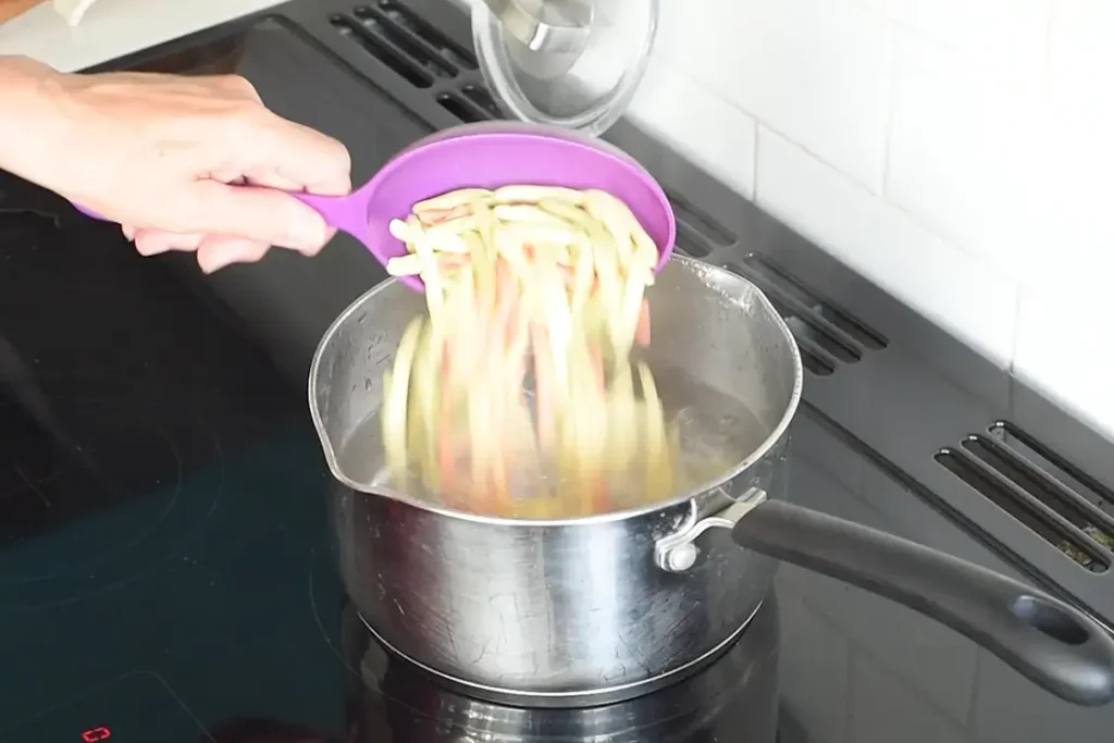 cook pasta in a medium sized pan of boiling salted water